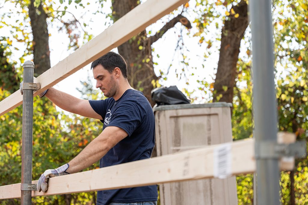 Man working on fence
