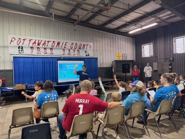 TFCU presenting to people at the fair
