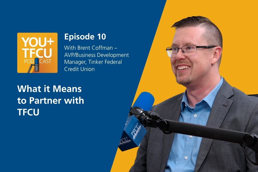 A man sits in front of a podcast microphone. Text reads: What it means to partner with TFCU