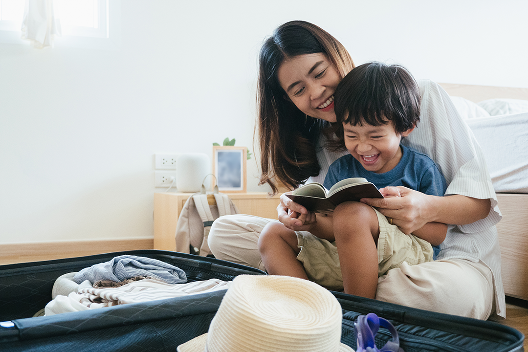 Mother and son packing for a trip