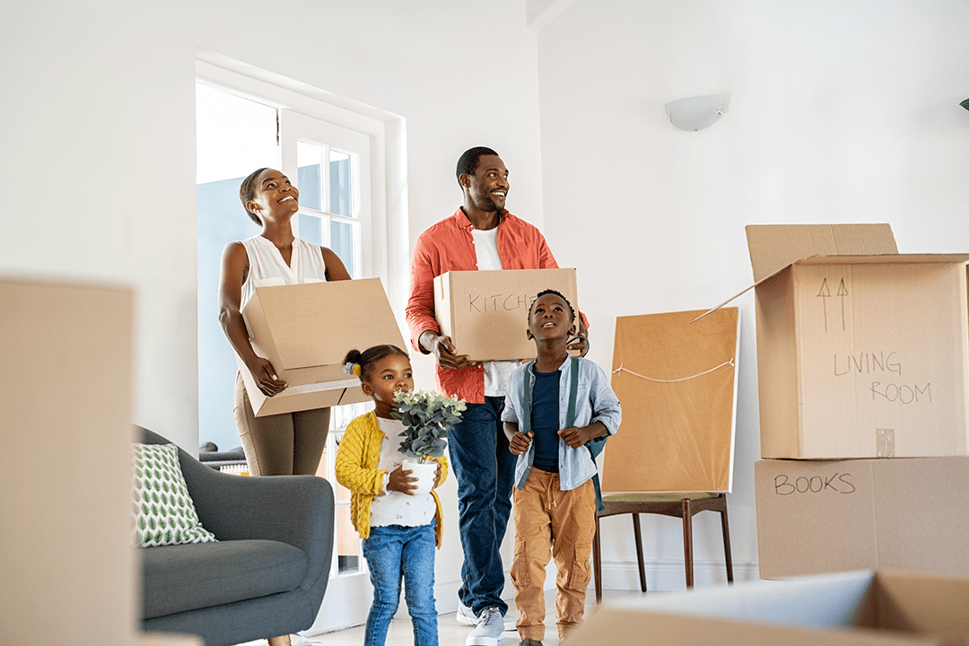 A mother, father and two little kids moving into a home