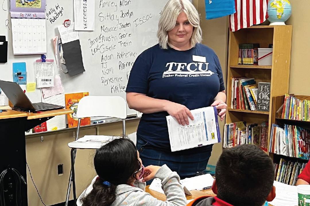 Woman standing in front of a classroom