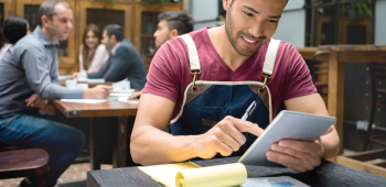 Business owner working from tablet