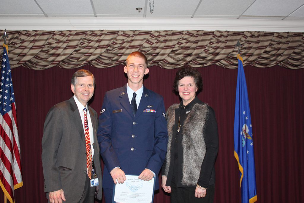 Mike and Pam Kloiber standing with an aireman