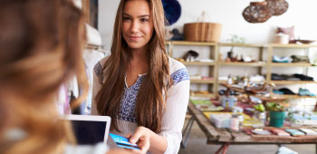 Young girl using a credit card for shopping