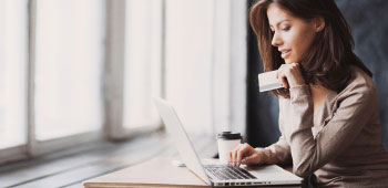 Female using credit card for online shopping