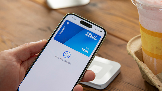 Close up of someone using digital wallet to pay.