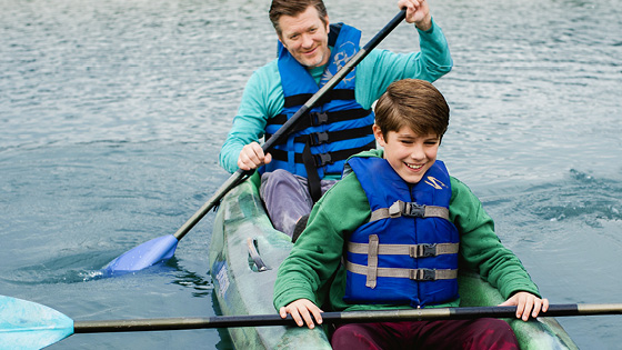 A man and his son kayaking