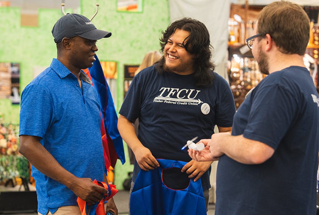 TFCU employees talking to a member at the state fair.