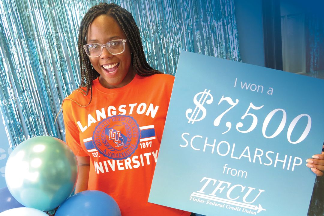 Langston nursing student Shanteara holds up sign showing she won a $7,500 scholarship from TFCU