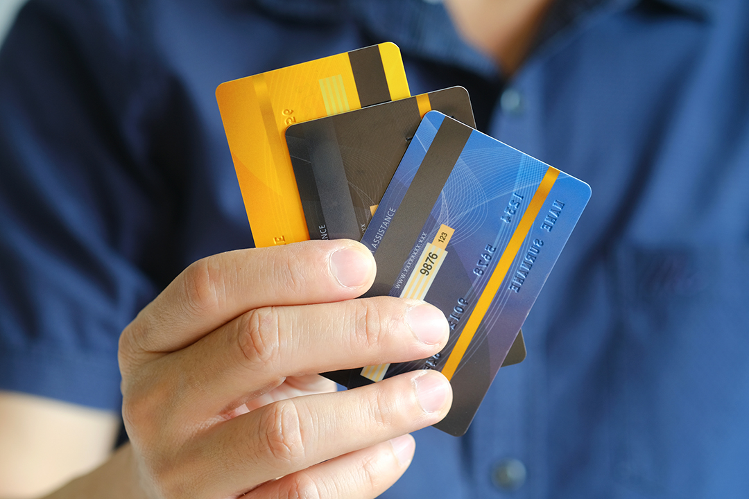 Close up of something holding up three credit cards