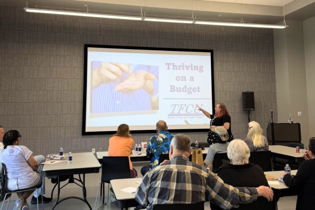 A TFCU financial educator leads a workshop on Thriving on a Budget