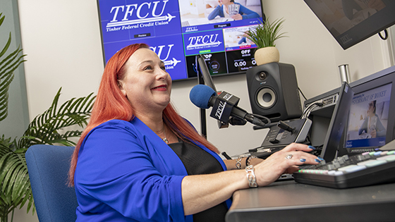 TFCU financial educator recording in a studio.