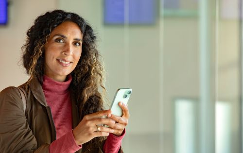 A lady on her mobile device.