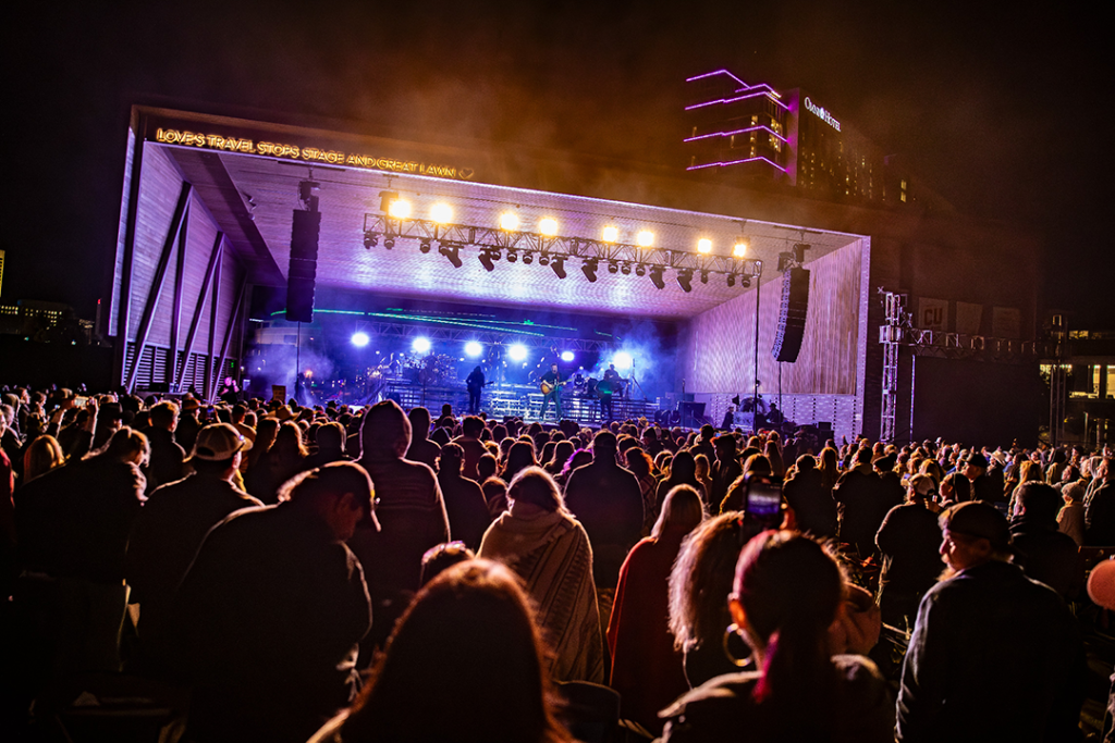 Photo from the crowd looking at the stage with performers for CU in the Park