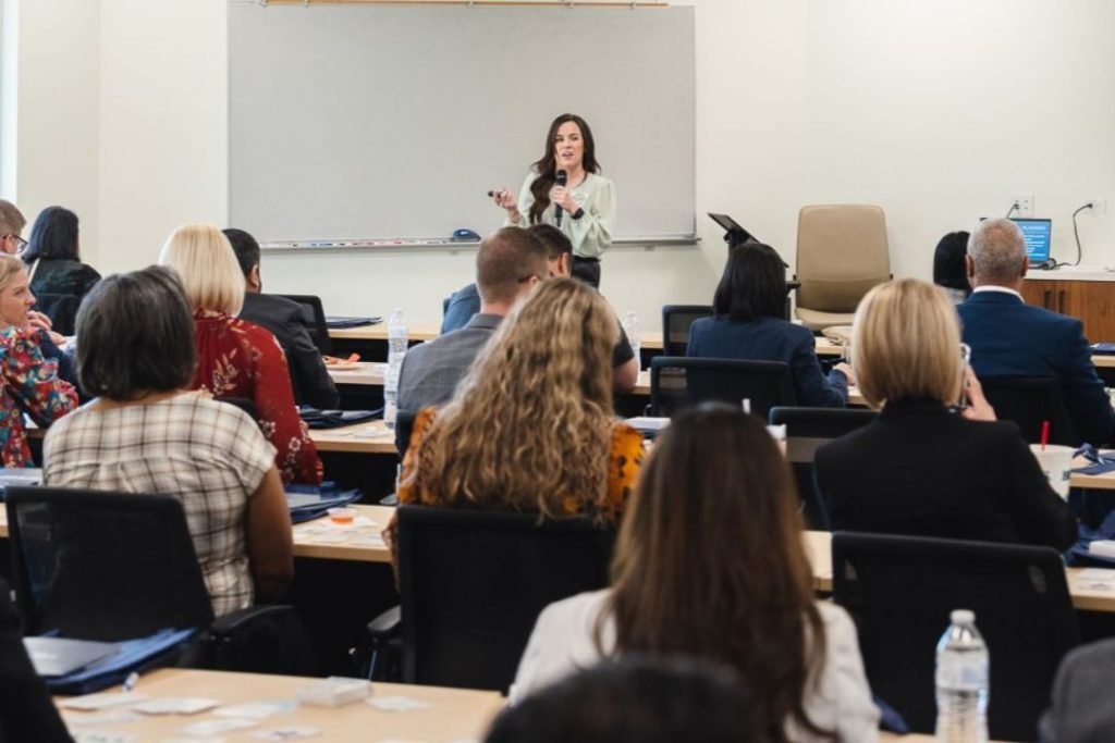 A TFCU financial educator speaks in a class