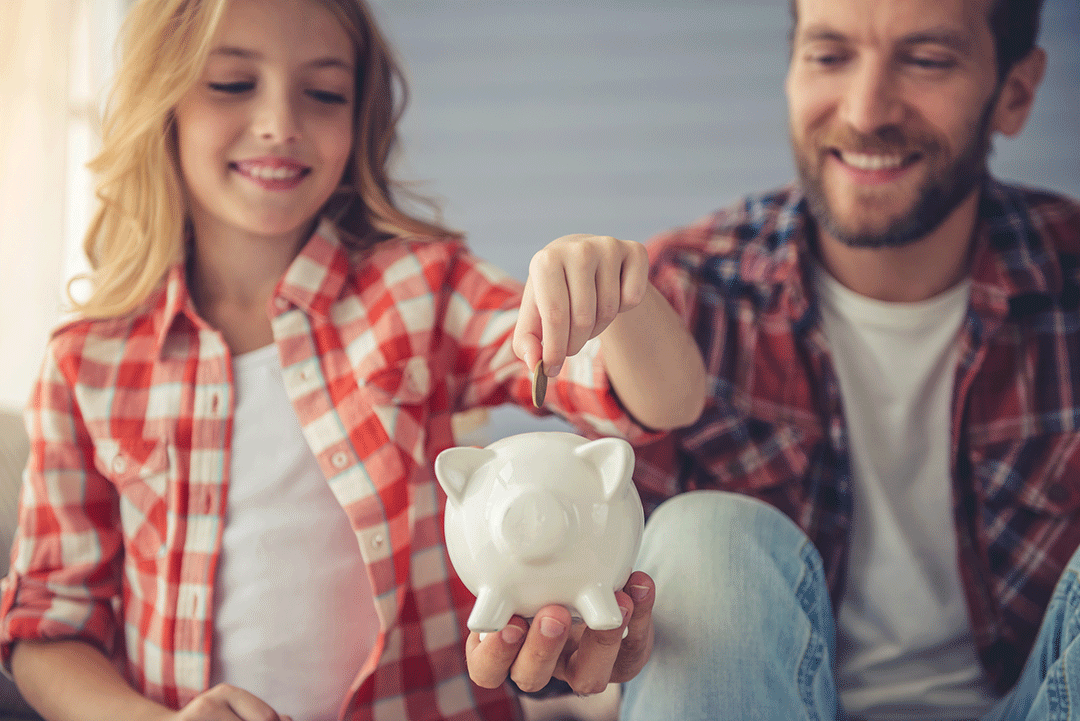 Father teaching daughter to save