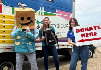 The TFCU mascot stands with two TFCU employees. One holds a sign that says "donate here"